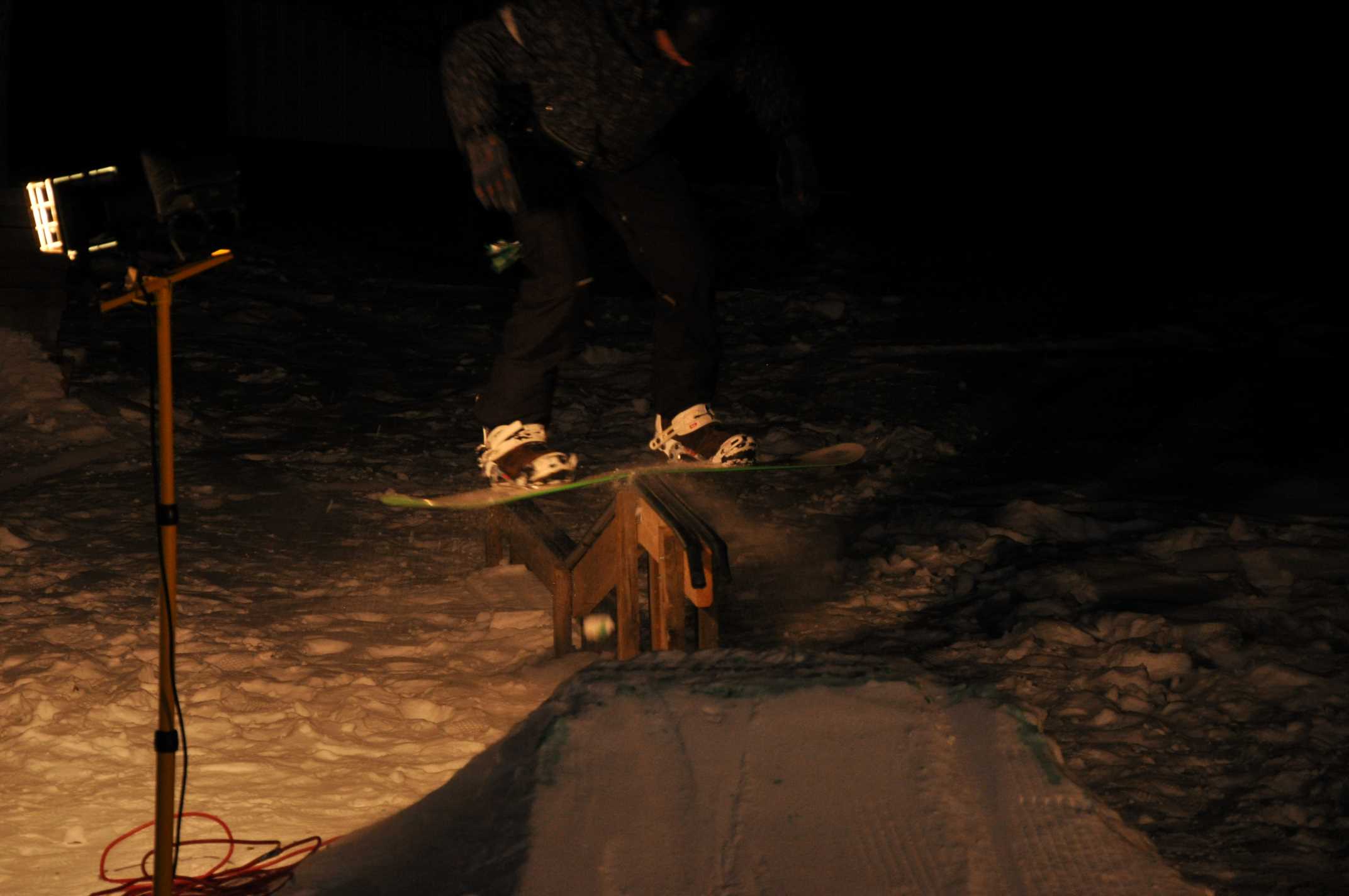 Keith doing a boardslide in Adam's backyard